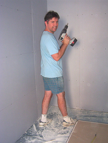 Applying the first layer of plasterboard