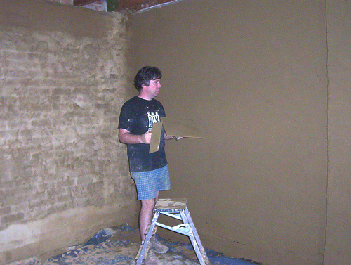 Plastering the wall ready for the Studio Wall System