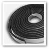 roll of black resilient foam tape with white release paper covering self-adhesive acoustic sealing tape Others